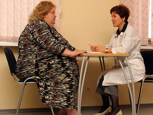 In a phlebologist's office, a patient with varicose veins caused by obesity. 